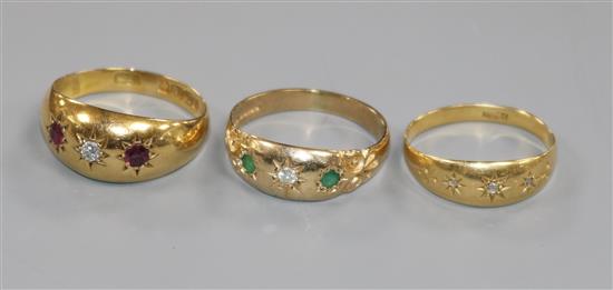 Two 18ct gold and gypsy set gem set rings and a 9ct gold and gypsy set gem set ring.